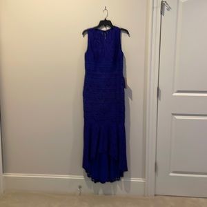 Beautiful blue sleeveless evening gown. Sleeveless and lined.